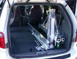 Showing how compact EC&MWs 2K P Model portable gantry crane inside a mini van.