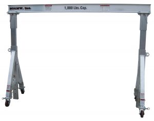 EC&MW, Inc 1 & 2 K cap Standard door gantry crane. This model uses the same concept as the removable leg. But in it's smallest configuration it is able to be rolled while loaded, through a standard 36" wide door.